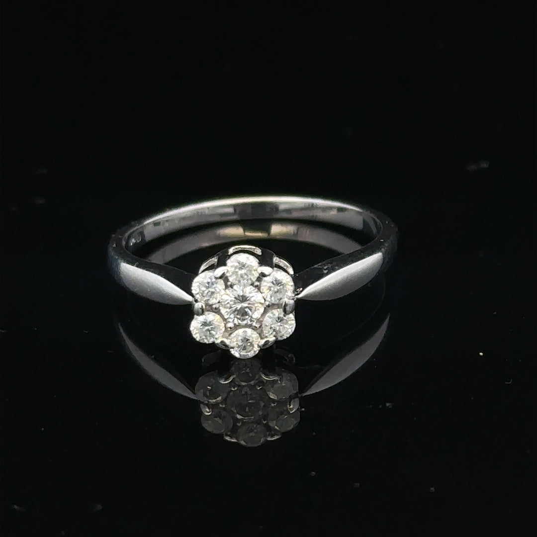 9ct white gold diamond cluster ring size O 1/2, featuring sparkling diamond accents on a polished band.