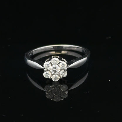 9ct white gold diamond cluster ring size O 1/2, featuring sparkling diamond accents on a polished band.