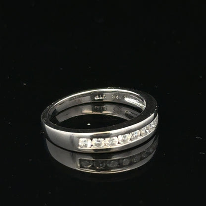 18ct white gold diamond ring in size L with sparkling diamonds, featuring a sleek and elegant design.