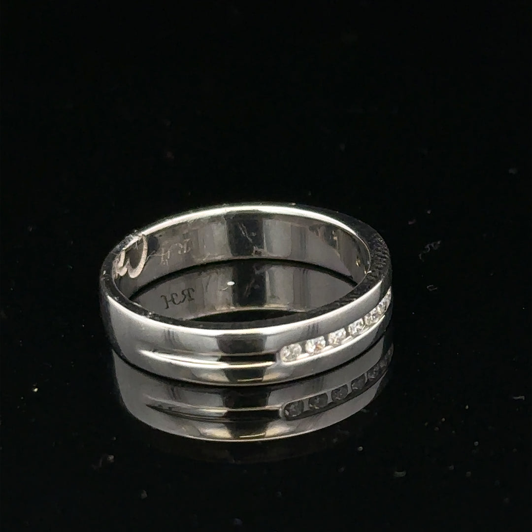 9ct white gold diamond ring with 0.20 carats, size M, featuring a sparkling gemstone and elegant design.
