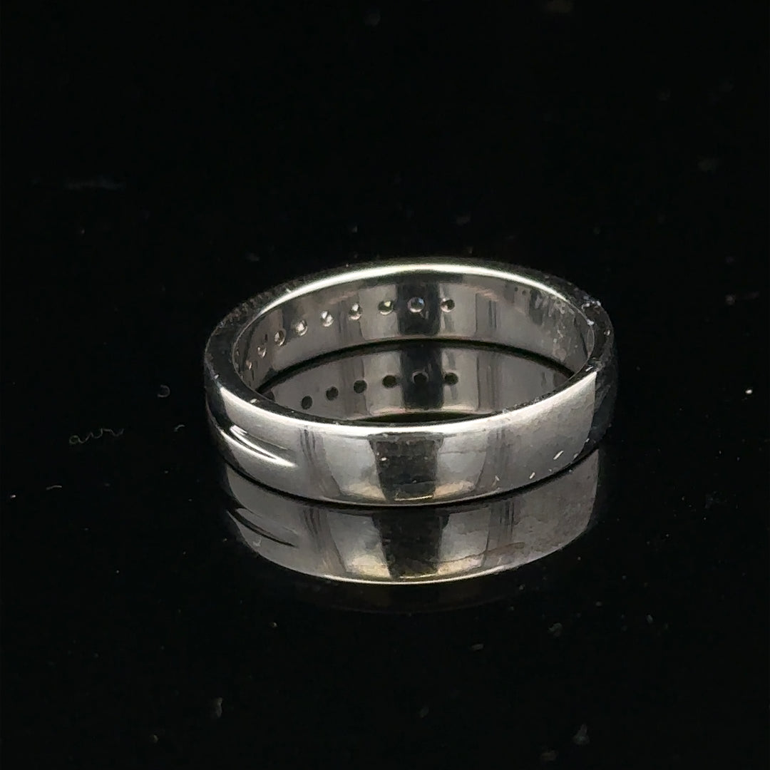 9ct white gold diamond ring with 0.20 carats, size M, featuring a sparkling central diamond and elegant band design.