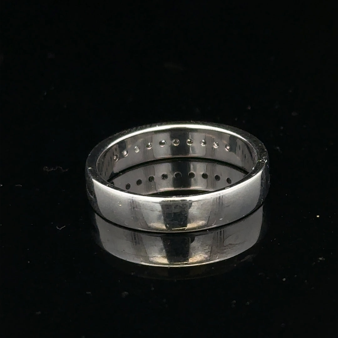 9ct white gold diamond ring with 0.20 carats, size M, featuring a simple, elegant design with sparkling stones.