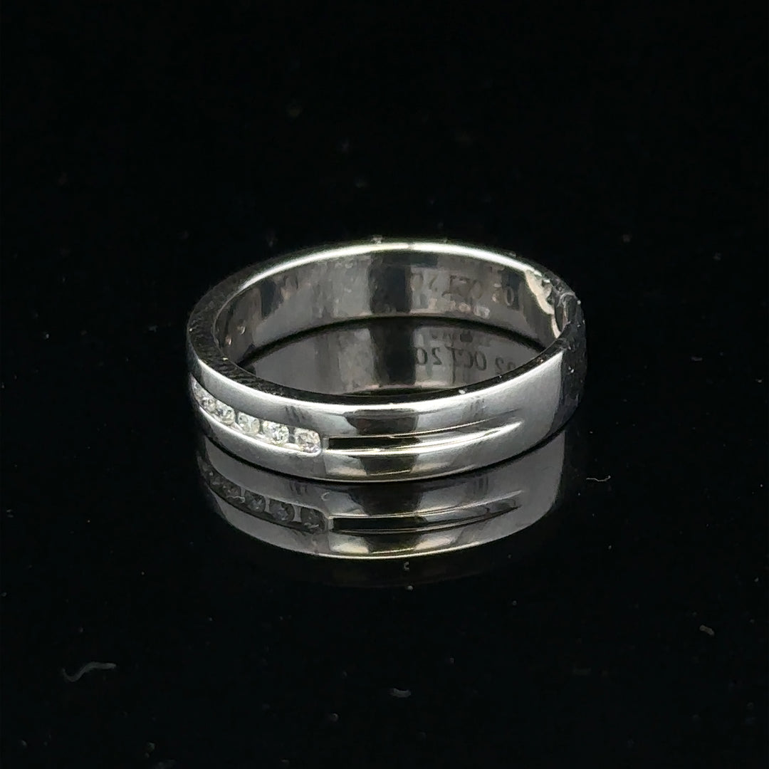 9ct white gold diamond ring with 0.20 carats, size M, featuring a sparkling central diamond and a sleek band design.