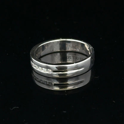9ct white gold diamond ring with 0.20 carats, size M, featuring a sparkling central diamond and a sleek band design.