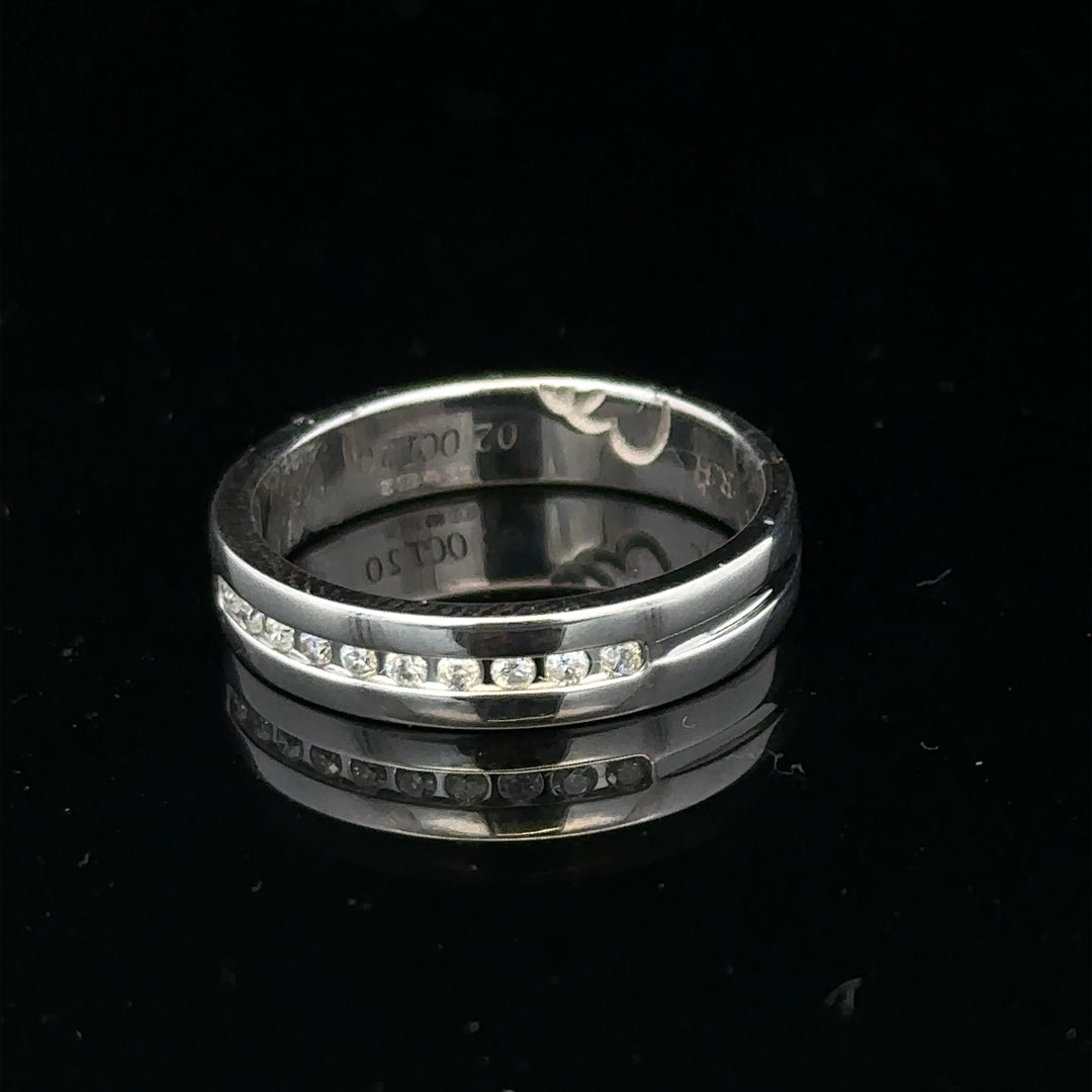 9ct white gold diamond ring with 0.20 carats, size M, featuring a sleek design and sparkling diamonds.