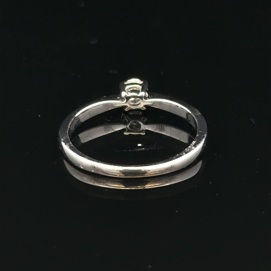18ct white gold diamond ring in size M, featuring sparkling diamonds and a sleek band design.