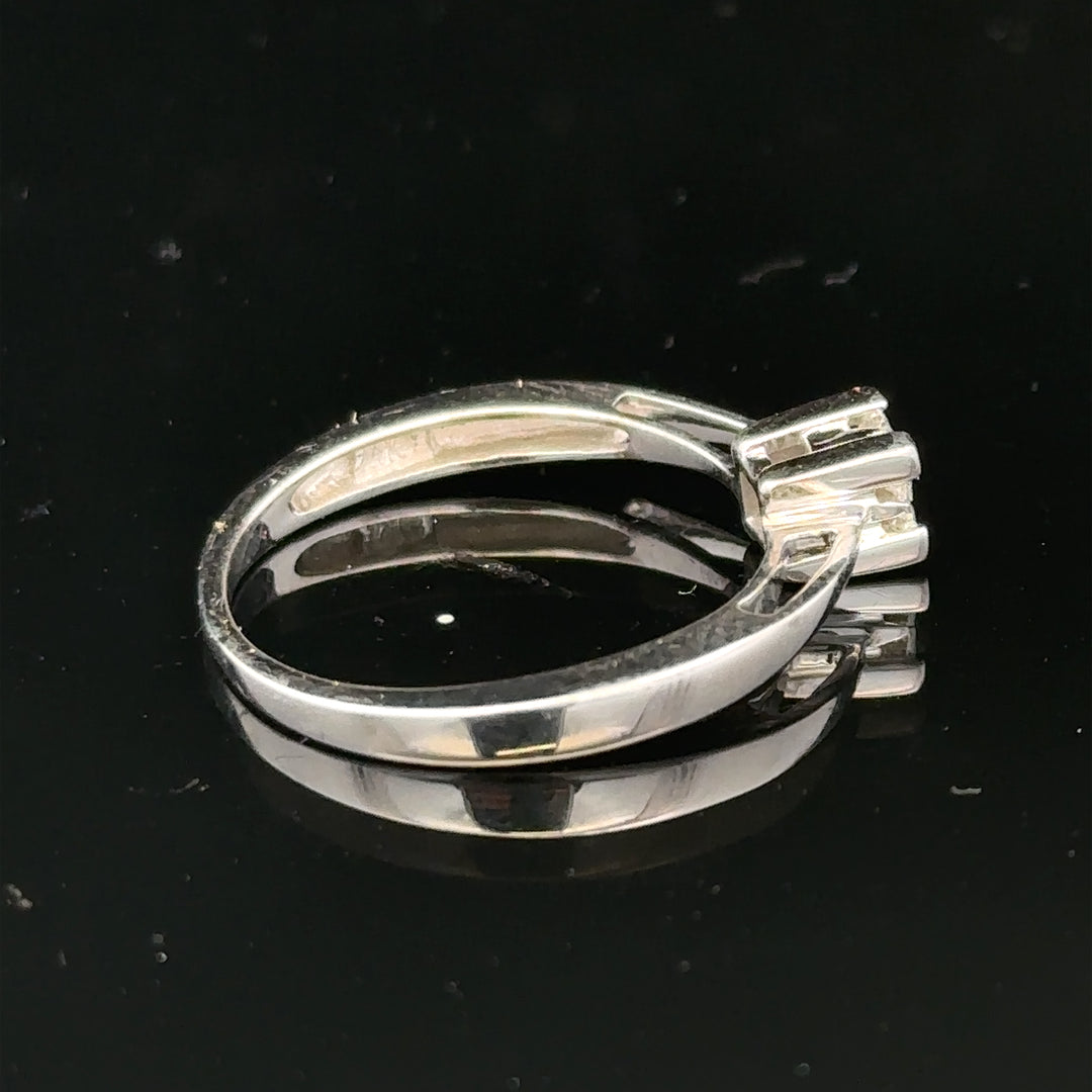9ct white gold diamond ring with sparkling diamonds set in a sleek band, showcasing elegant jewelry craftsmanship.
