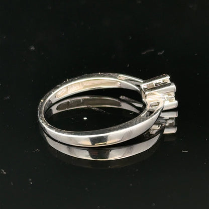 9ct white gold diamond ring with sparkling diamonds set in a sleek band, showcasing elegant jewelry craftsmanship.