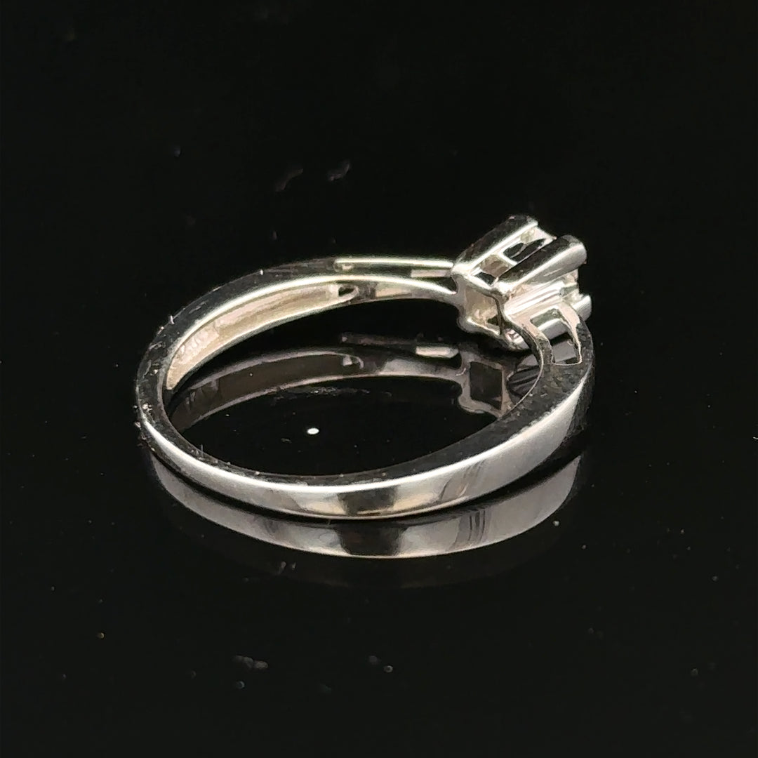 9ct white gold diamond ring with sparkling diamonds set in a sleek band, showcasing elegant jewelry craftsmanship.