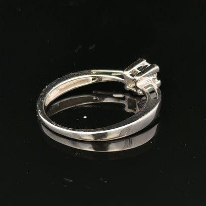 9ct white gold diamond ring with sparkling diamonds set in a sleek band, showcasing elegant jewelry craftsmanship.