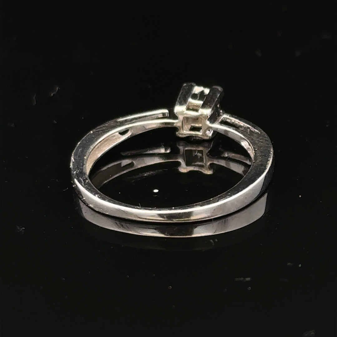 Elegant 9ct white gold diamond ring featuring sparkling diamonds set in a classic band design.