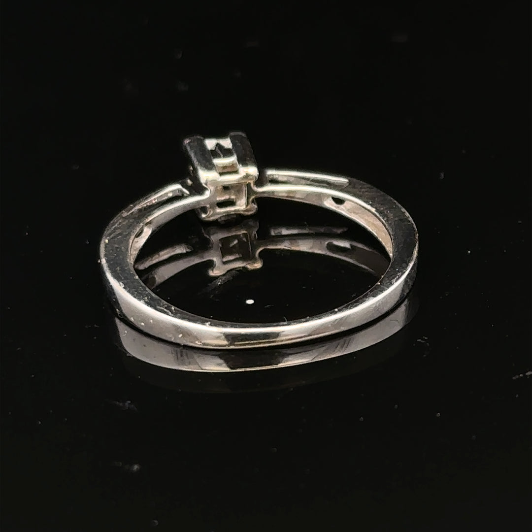 Elegant 9ct white gold diamond ring with sparkling diamonds set in a classic design.
