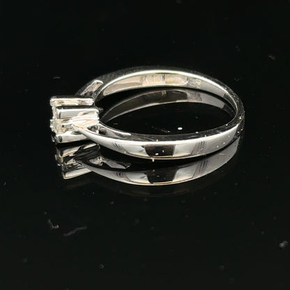 Elegant 9ct white gold diamond ring with sparkling diamonds, showcasing its intricate design and shiny finish.