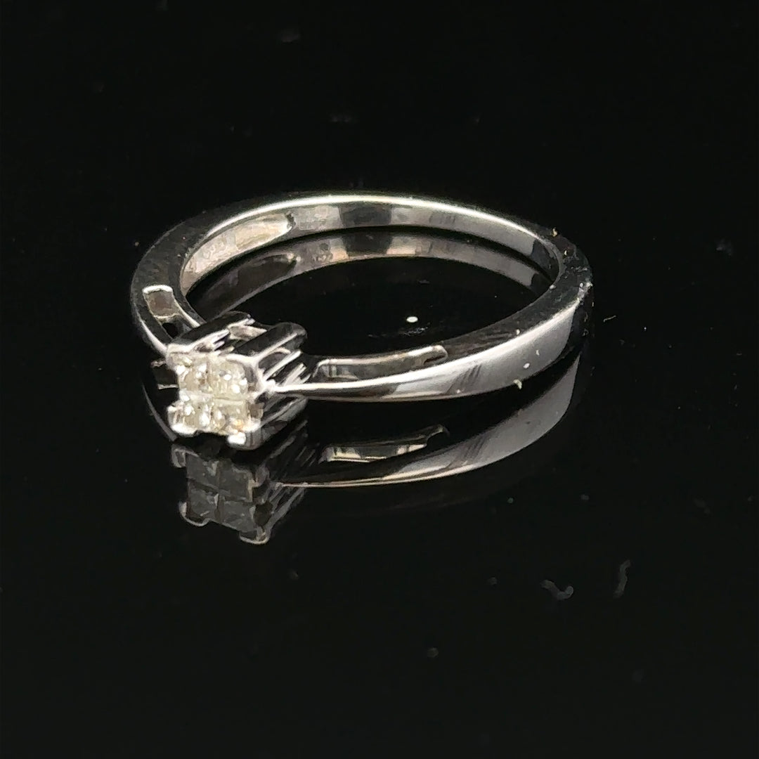 9ct white gold diamond ring featuring a sparkling central diamond and elegant band design.