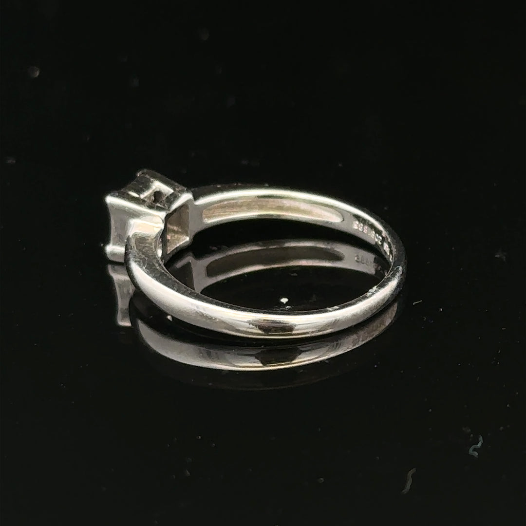 18ct white gold diamond ring with a solitaire setting, size J1/2, featuring sparkling diamonds and a sleek, elegant design.