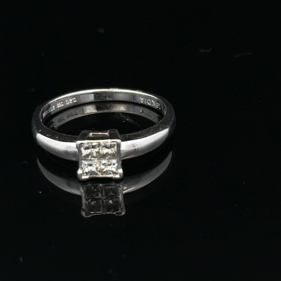 18ct white gold diamond ring with a solitaire setting, size J1/2, elegant jewelry piece with sparkling diamonds.