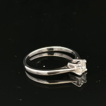 18ct yellow gold diamond ring with a 1/3 carat princess cut diamond, size M, featuring elegant, classic jewelry design.
