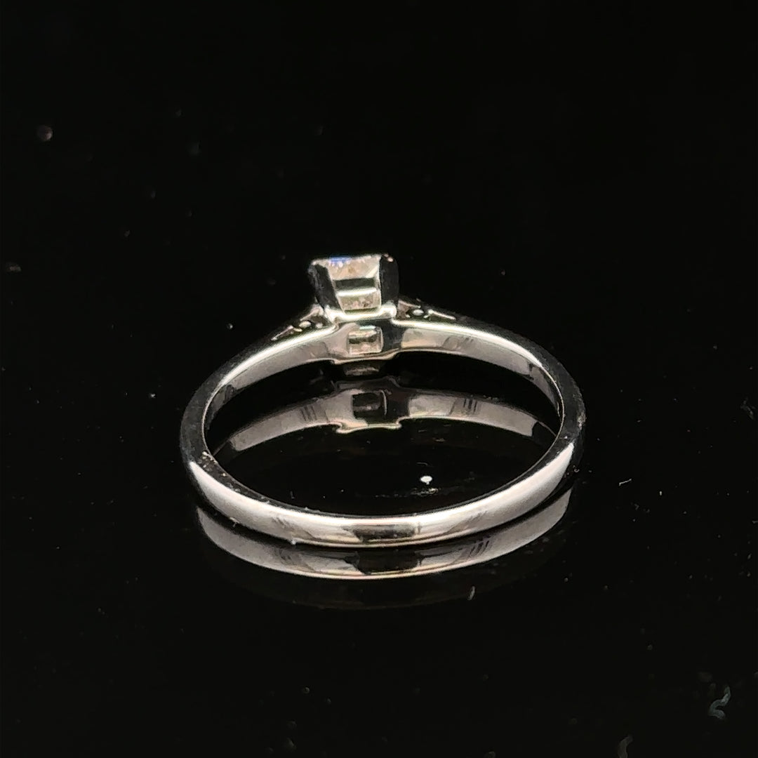 18ct yellow gold diamond ring with 1/3 carat princess cut diamond, size M, elegant jewelry piece.