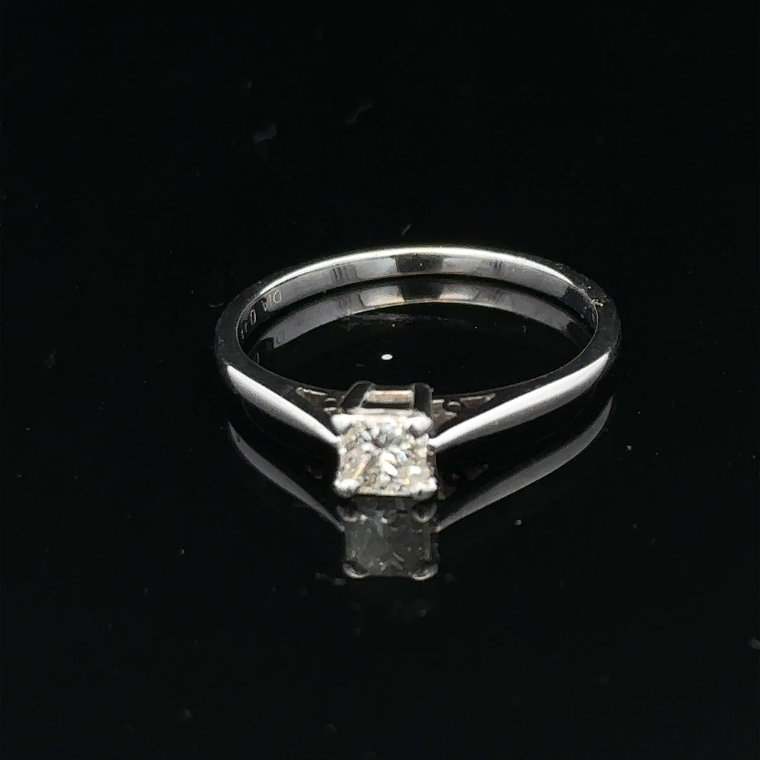 18ct yellow gold diamond ring with a 1/3 carat princess cut diamond, size M, featuring a sleek, elegant design.