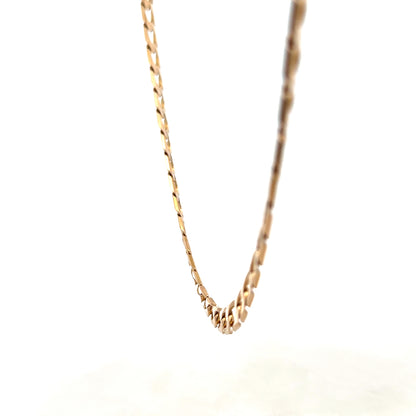 Reeves and Sons 9ct yellow gold curb chain, 27.6g, showing the detailed links and polished finish of the jewelry.