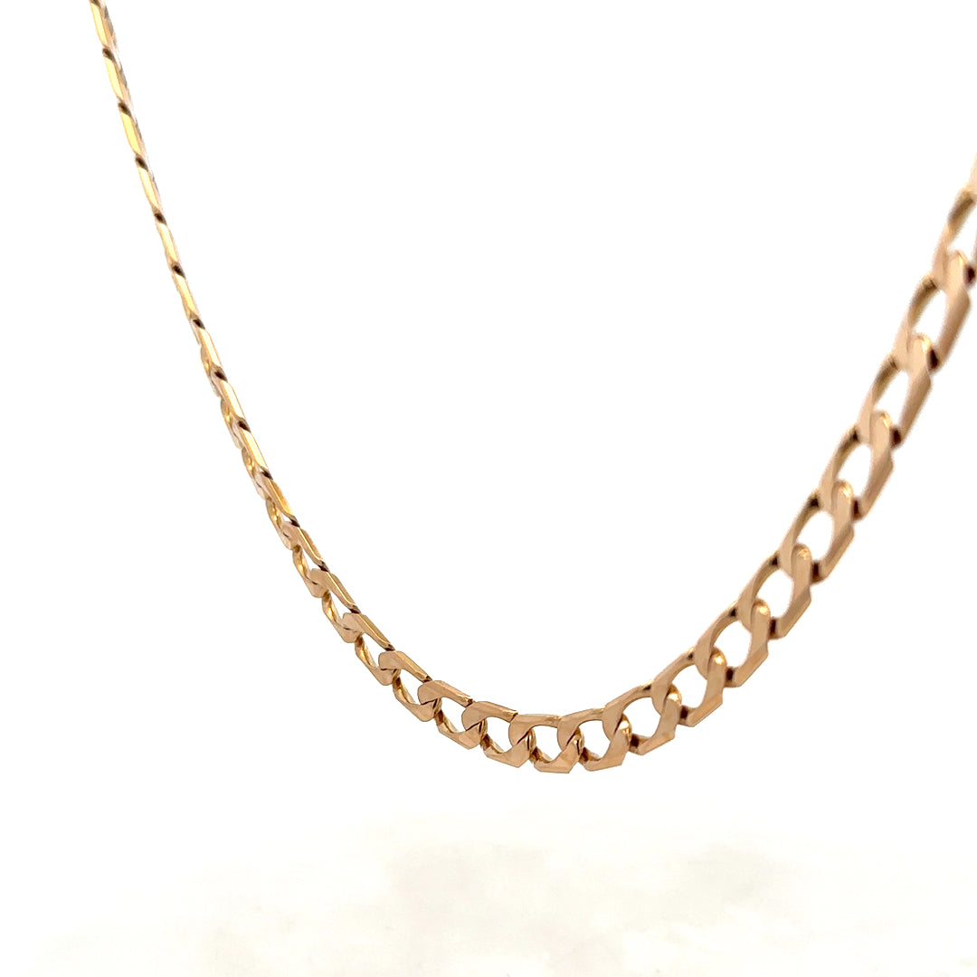 9ct yellow gold curb chain weighing 27.6g from Reeves and Sons, close-up showing smooth links and shiny finish.