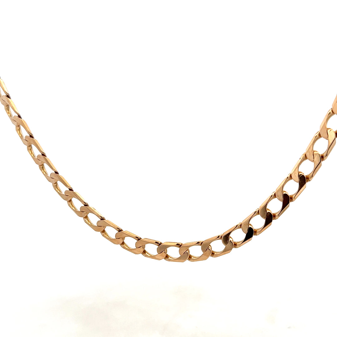 9ct yellow gold curb chain weighing 27.6g, crafted by Reeves and Sons, displayed on a neutral background.