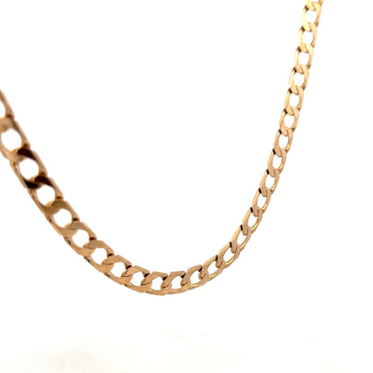 Reeves and Sons 9ct yellow gold curb chain weighing 27.6g, showcasing its polished links and craftsmanship.