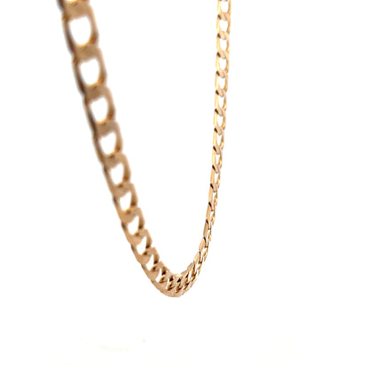 Reeves and Sons 9ct yellow gold curb chain with a sturdy link design, weighing 27.6g, displayed against a neutral background.