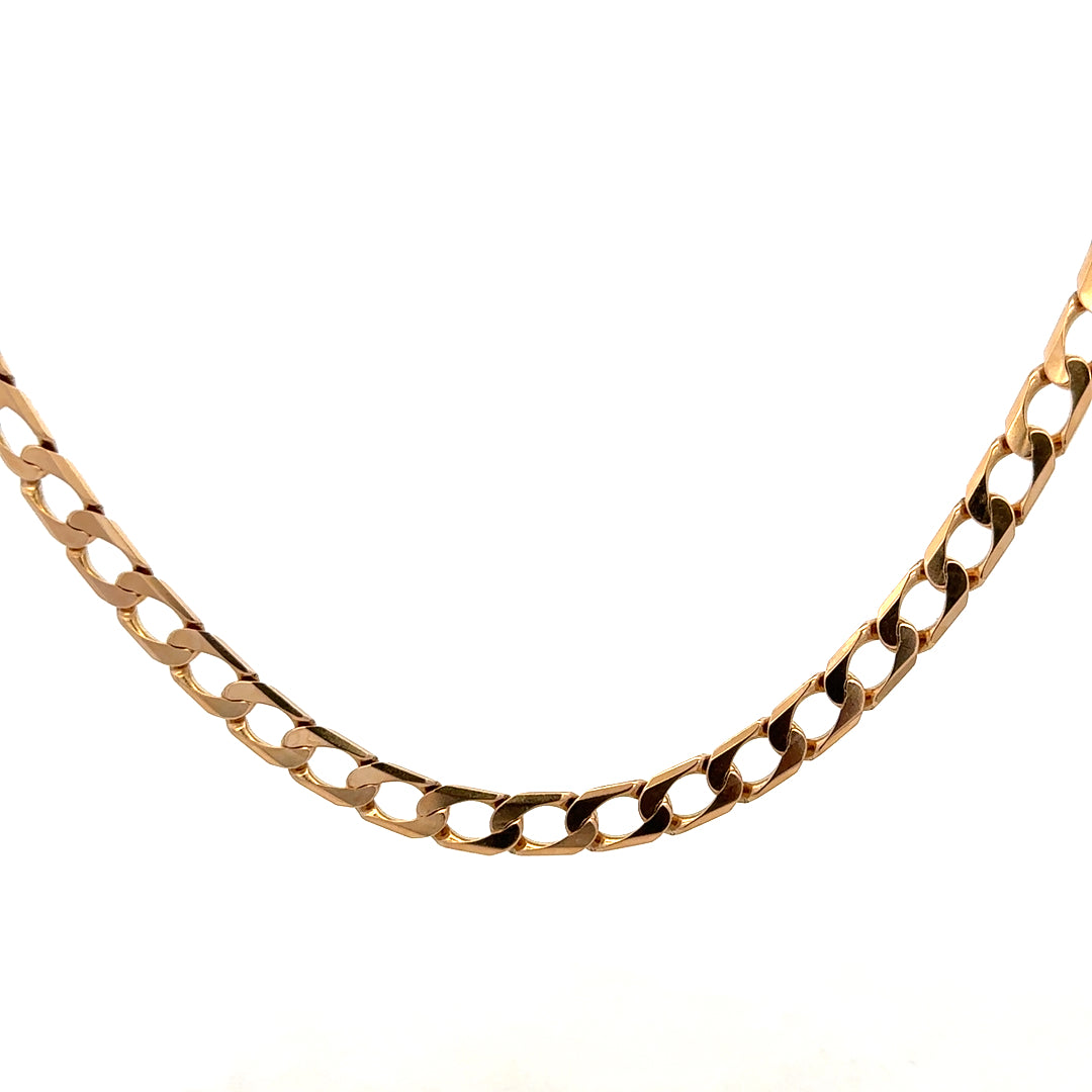 9ct yellow gold curb chain weighing 27.6g, featuring a classic linked design from Reeves and Sons.