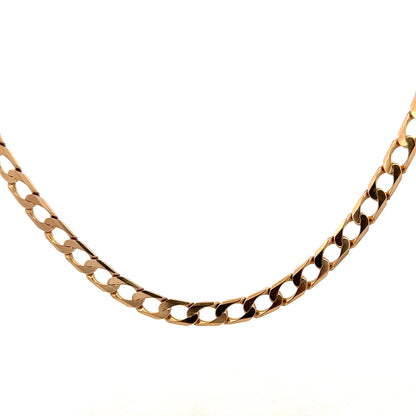 9ct yellow gold curb chain weighing 27.6g, featuring a classic linked design from Reeves and Sons.