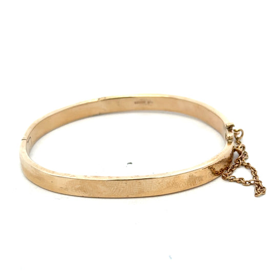 Reeves and Sons 9ct yellow gold bracelet bangle weighing 24.1g, smooth polished surface, elegant jewelry accessory