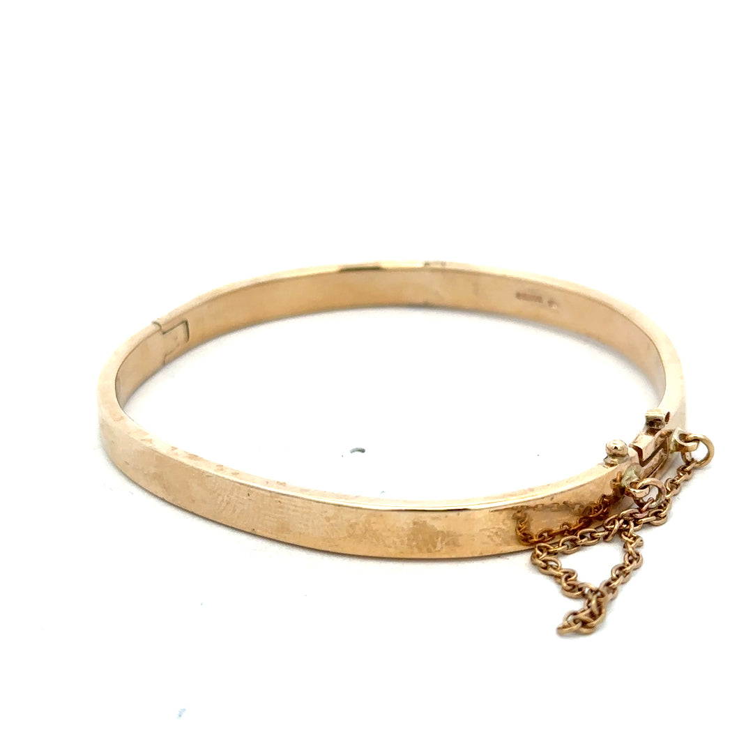 9ct yellow gold bracelet with a smooth, polished finish, weighing 24.1g, from Reeves and Sons.