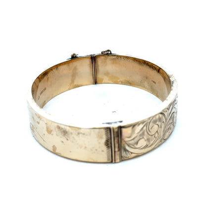 Reeves and Sons 9ct yellow gold bangle bracelet, 22.7g, smooth polished finish, showcasing elegant jewelry design.