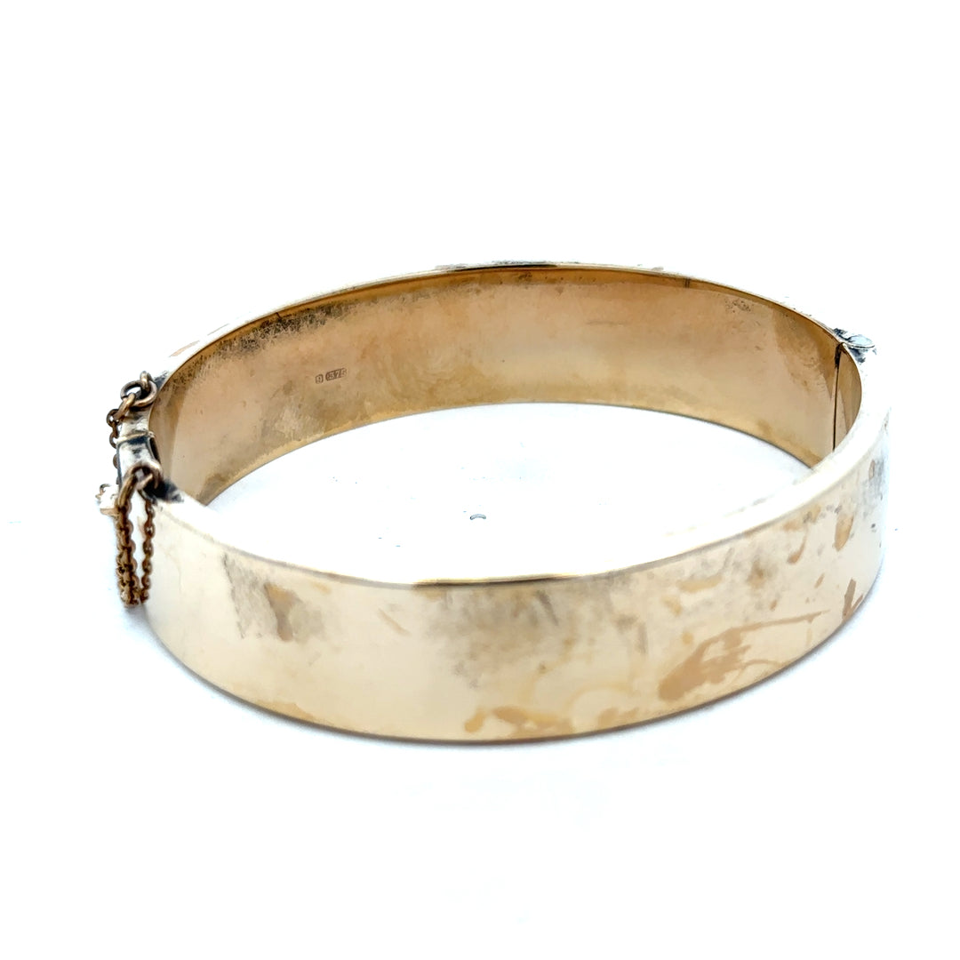 Reeves and Sons 9ct yellow gold bracelet bangle, weighing 22.7g, with smooth polished finish and classic design.