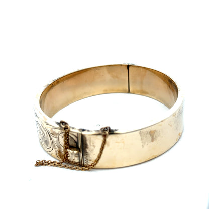 9ct yellow gold bracelet from Reeves and Sons, 22.7g, showing the smooth, polished bangle with a shiny finish.