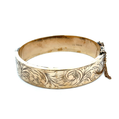 Reeves and Sons 9ct yellow gold bracelet bangle, 22.7g, with smooth polished finish and rounded shape.