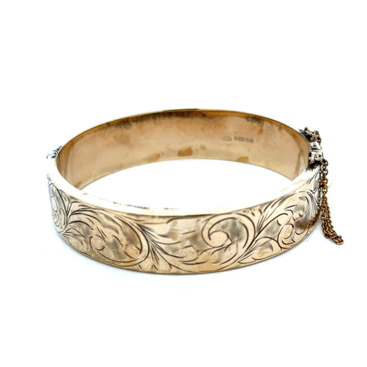 Reeves and Sons 9ct yellow gold bracelet bangle, 22.7g, with smooth polished finish and rounded shape.