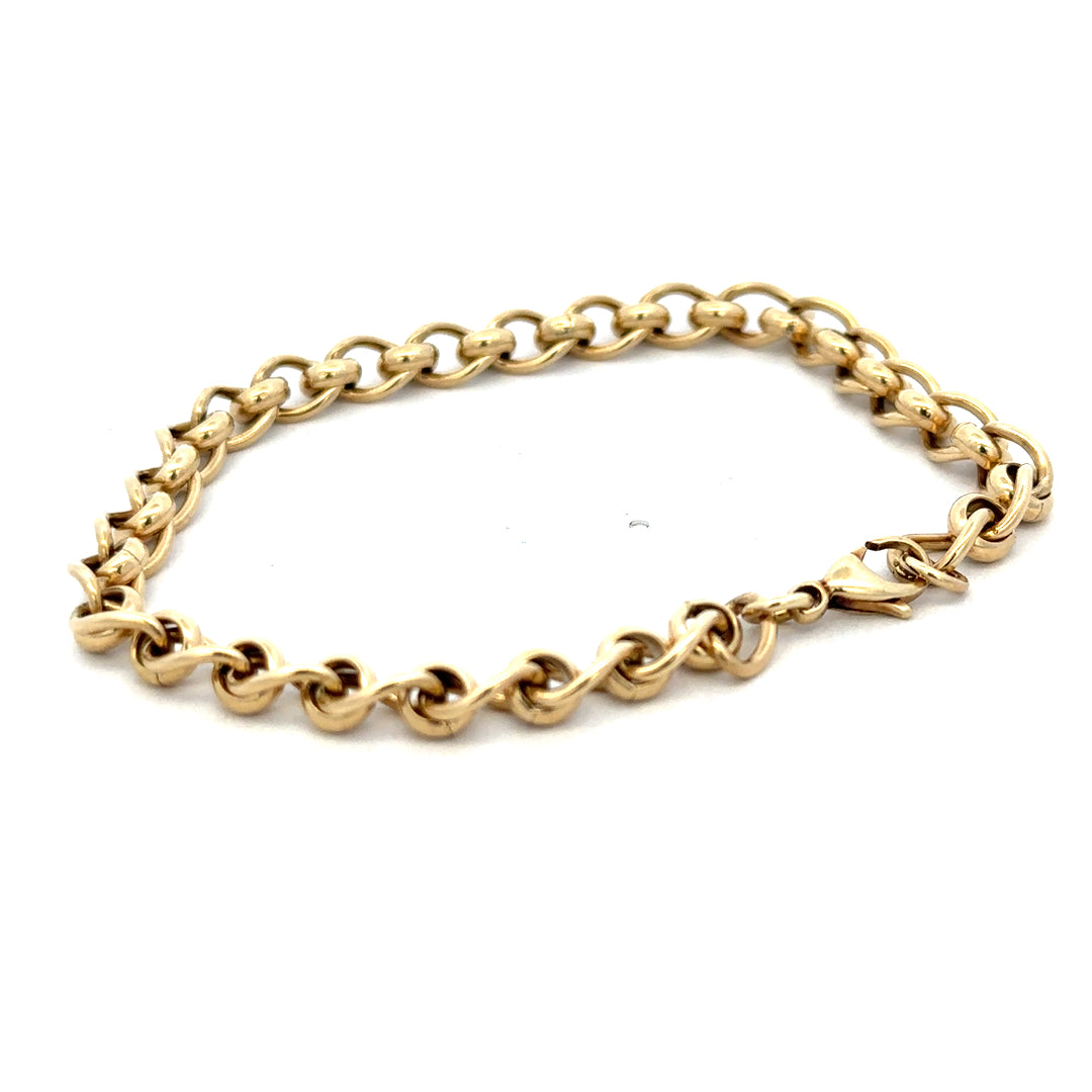 Reeves and Sons 9ct yellow gold rollerball bracelet with a sleek design, weighing 13.2g, displayed on a neutral background.