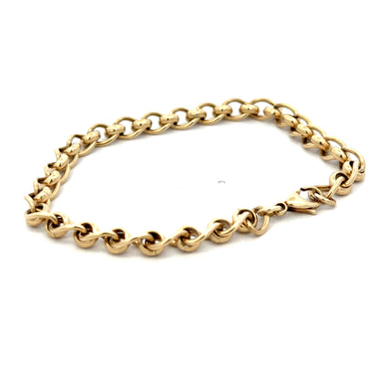 Reeves and Sons 9ct yellow gold rollerball bracelet with a sleek design, weighing 13.2g, displayed on a neutral background.