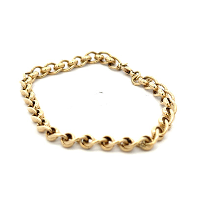 9ct yellow gold rollerball bracelet by Reeves and Sons featuring smooth, shiny gold beads on a sleek design.