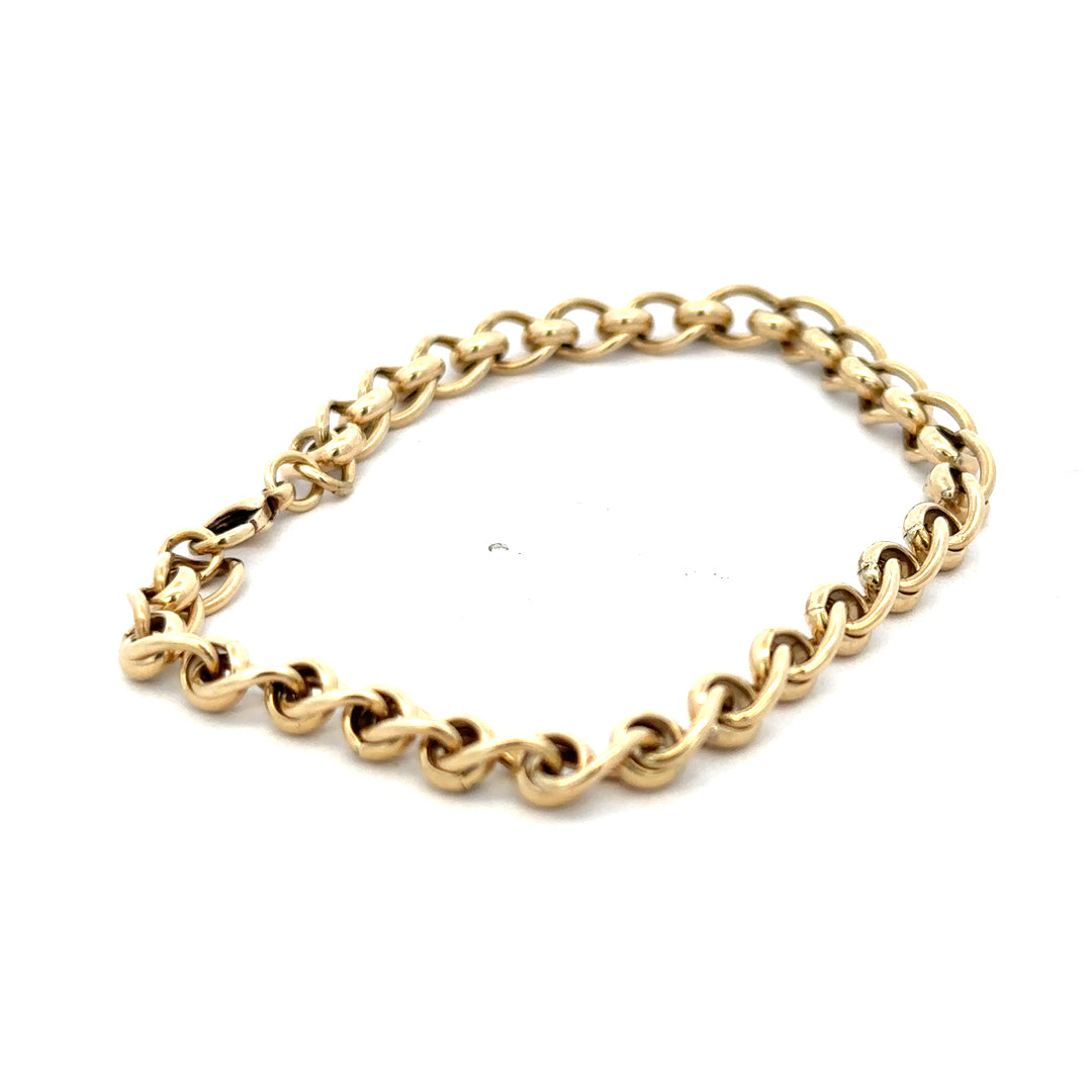9ct yellow gold rollerball bracelet with a sleek design and smooth gold finish, weighing 13.2g, by Reeves and Sons.