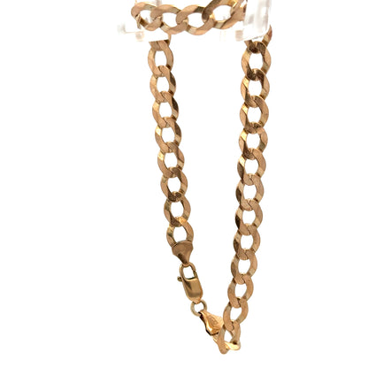 9ct yellow gold curb bracelet with a polished finish, weighing 7.7g, from Reeves and Sons.