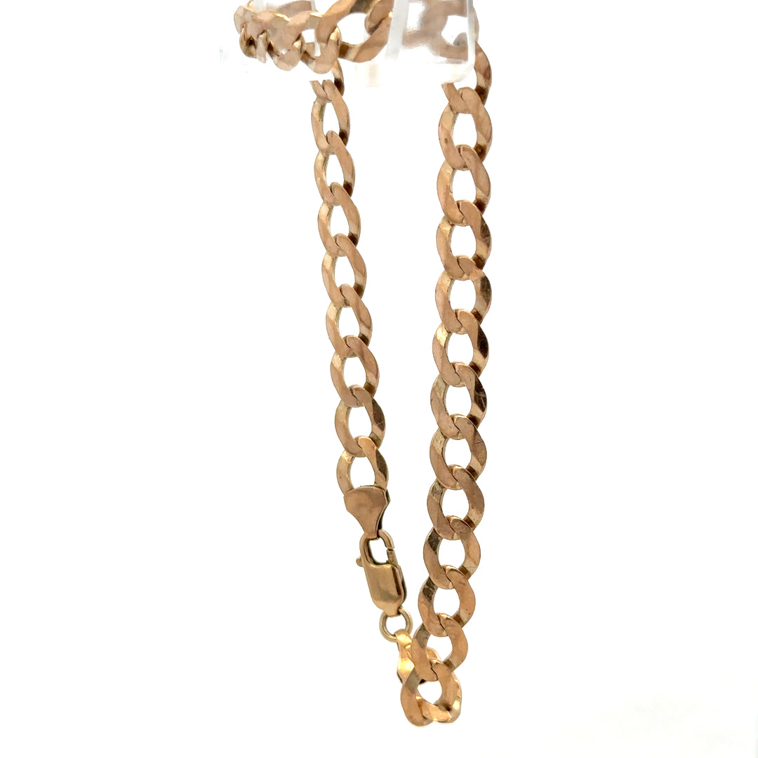 Reeves and Sons 9ct yellow gold curb bracelet weighing 7.7g, featuring interlinked gold curb chain design.