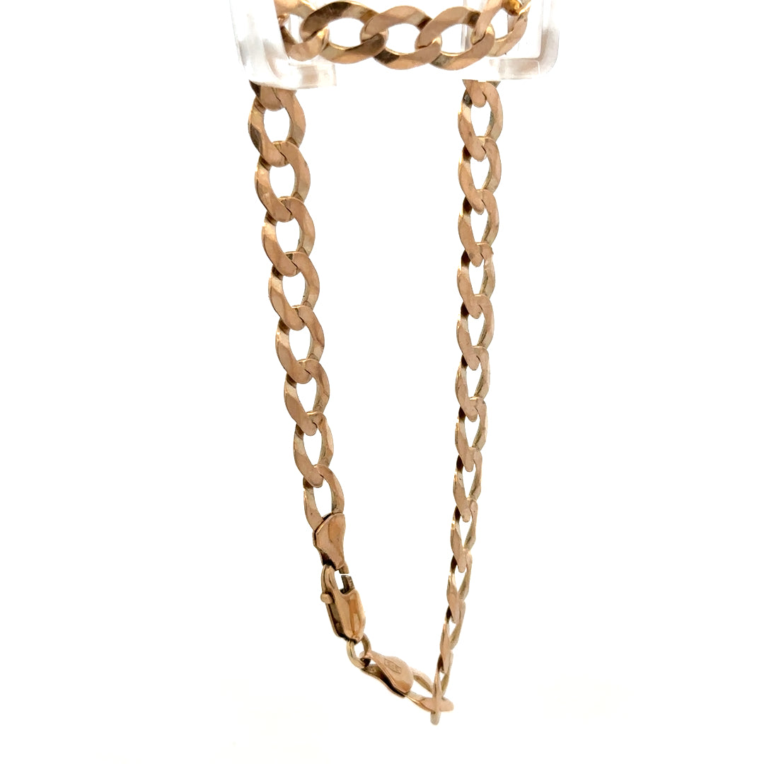 9ct yellow gold curb bracelet with polished links, weighing 7.7g, by Reeves and Sons, displayed on a neutral background.
