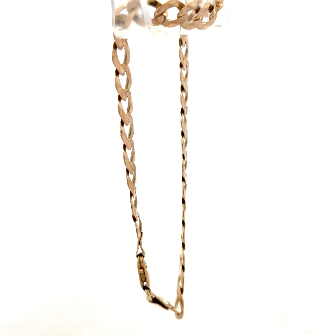 9ct yellow gold curb bracelet with a polished finish, weighing 7.7g, featuring interlinked oval links from Reeves and Sons.