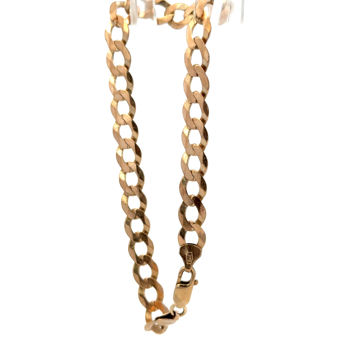 9ct yellow gold curb bracelet with a polished finish, weighing 7.7g, from Reeves and Sons.