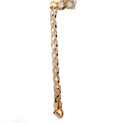 9ct yellow gold curb bracelet from Reeves and Sons with a smooth chain design, weighing 7.7 grams.