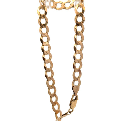 9ct yellow gold curb bracelet by Reeves and Sons with a polished finish, showcasing its linked chain design and secure clasp.