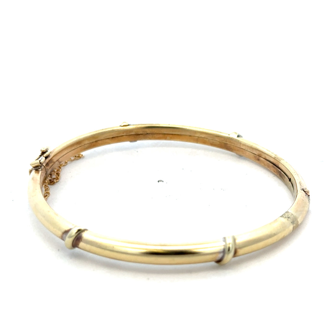 Reeves and Sons 9ct yellow gold bracelet bangle with smooth polished finish, weighing 11.1g, elegant jewelry accessory