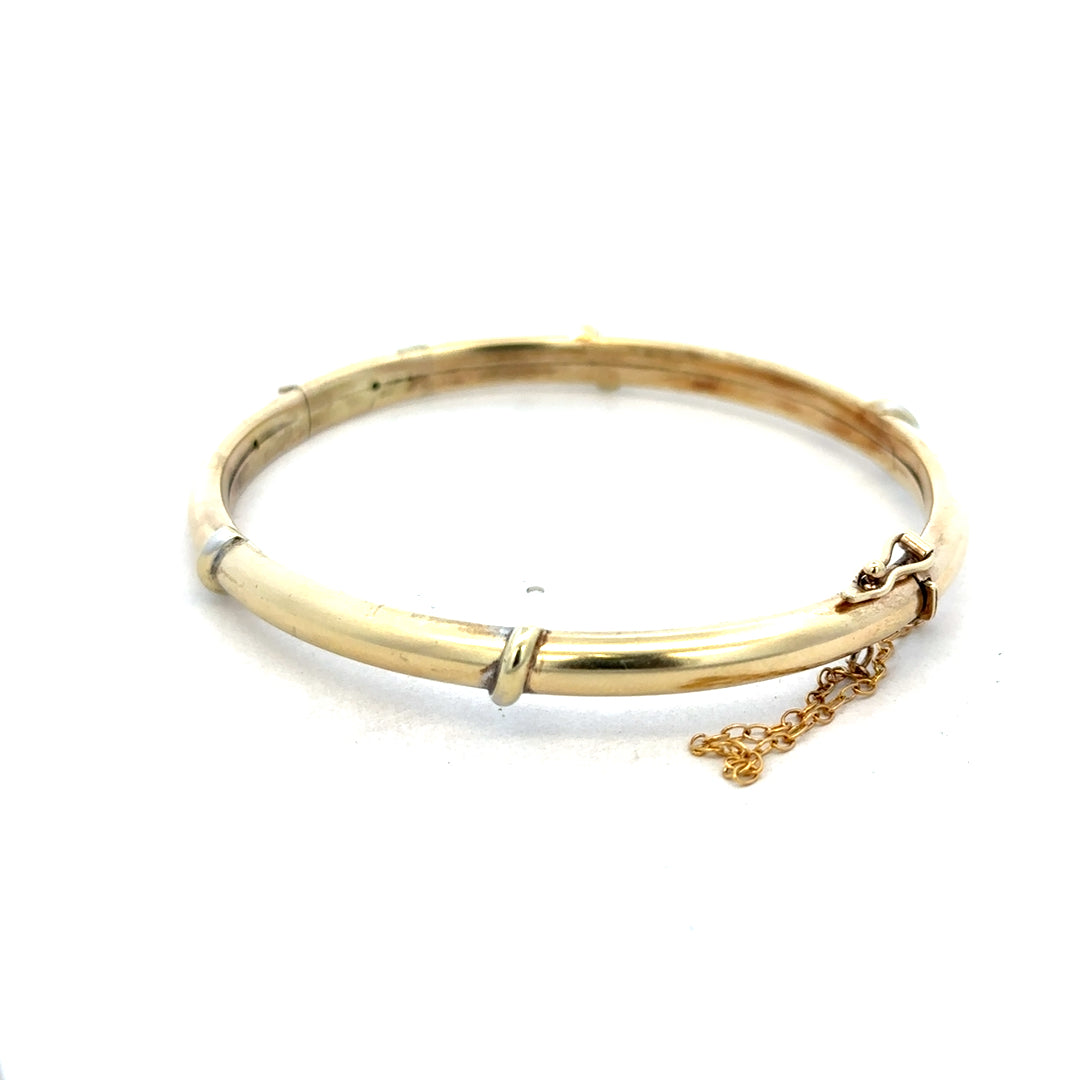 Reeves and Sons 9ct yellow gold bracelet bangle, lightweight and elegant, with a smooth polished finish, 11.1g weight.
